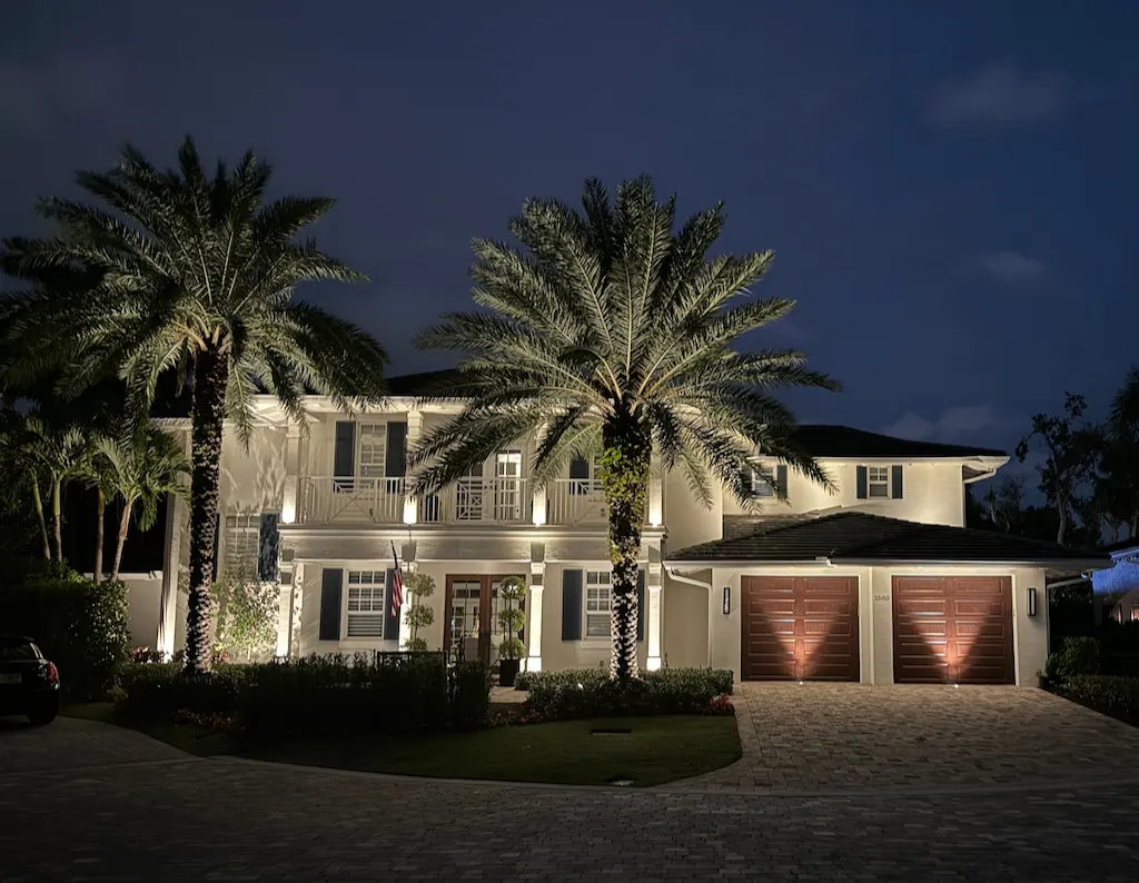 Beach house landscape lighting with palm tree uplighting in Isle of Palms SC