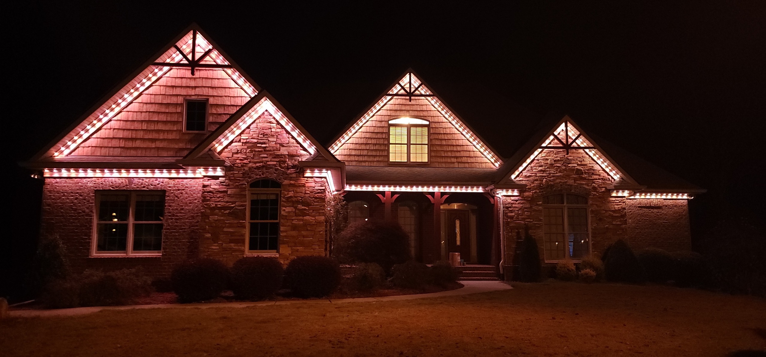 Low voltage permanent outdoor lighting installed as low profile exterior trim lighting on a Charleston home
