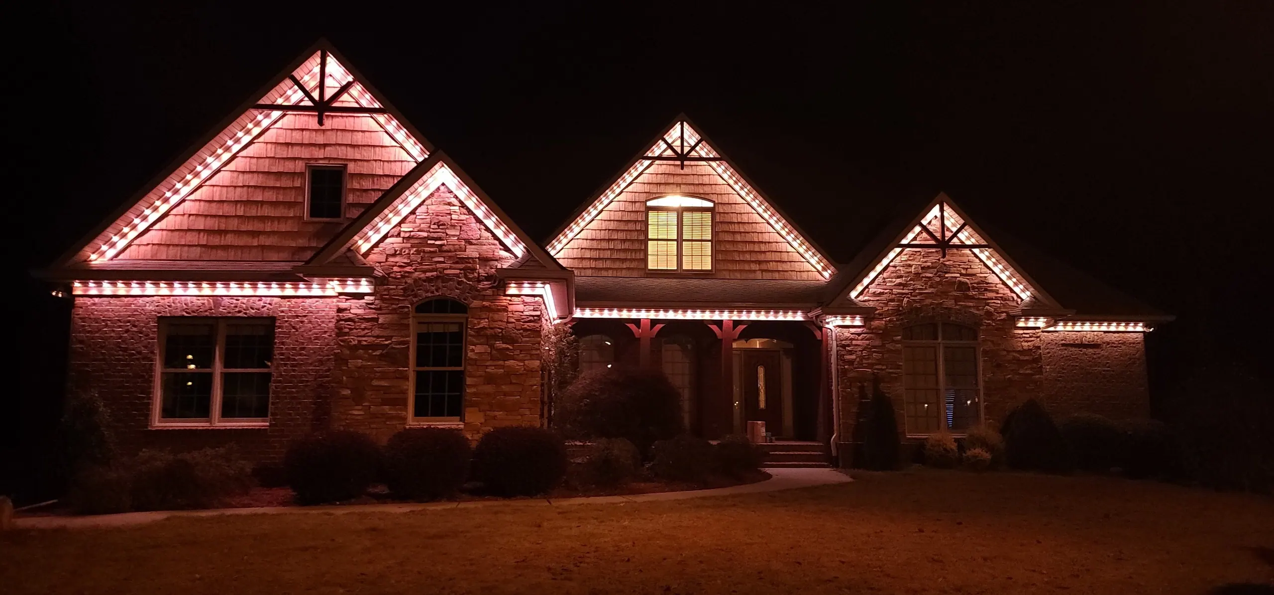 Low voltage permanent outdoor lighting installed as low profile exterior trim lighting on a Charleston home