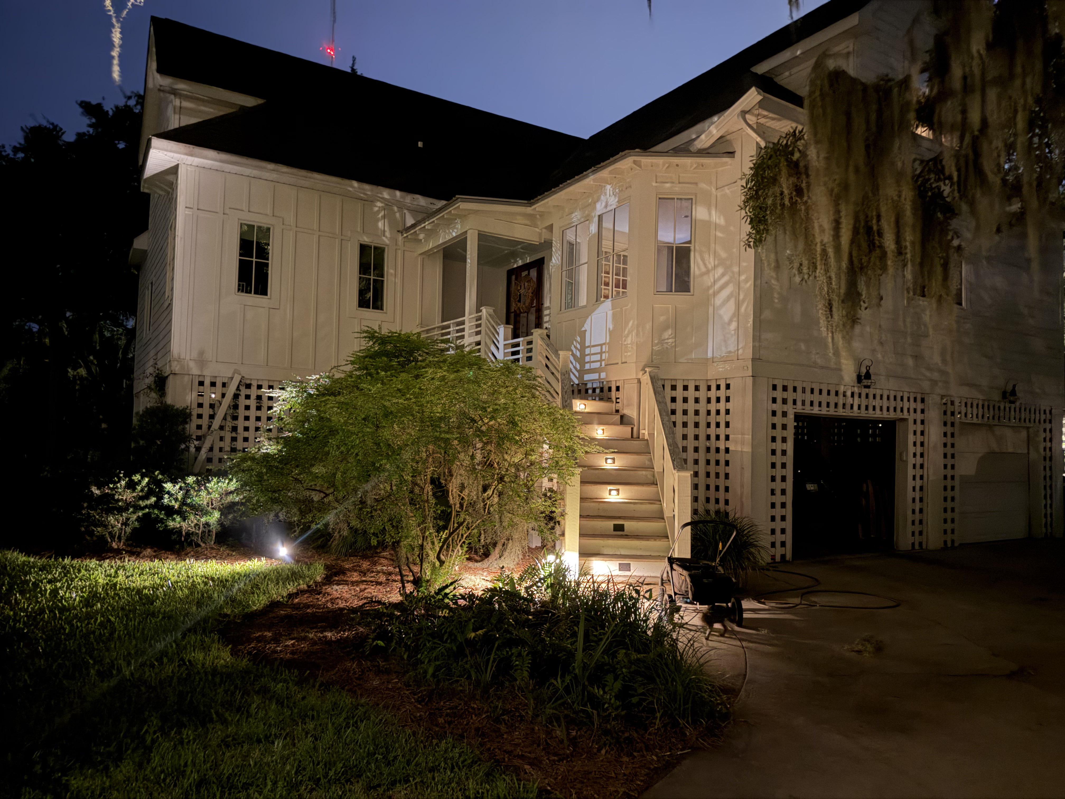 Warm low voltage stair lighting on outdoor steps at a Mount Pleasant SC home