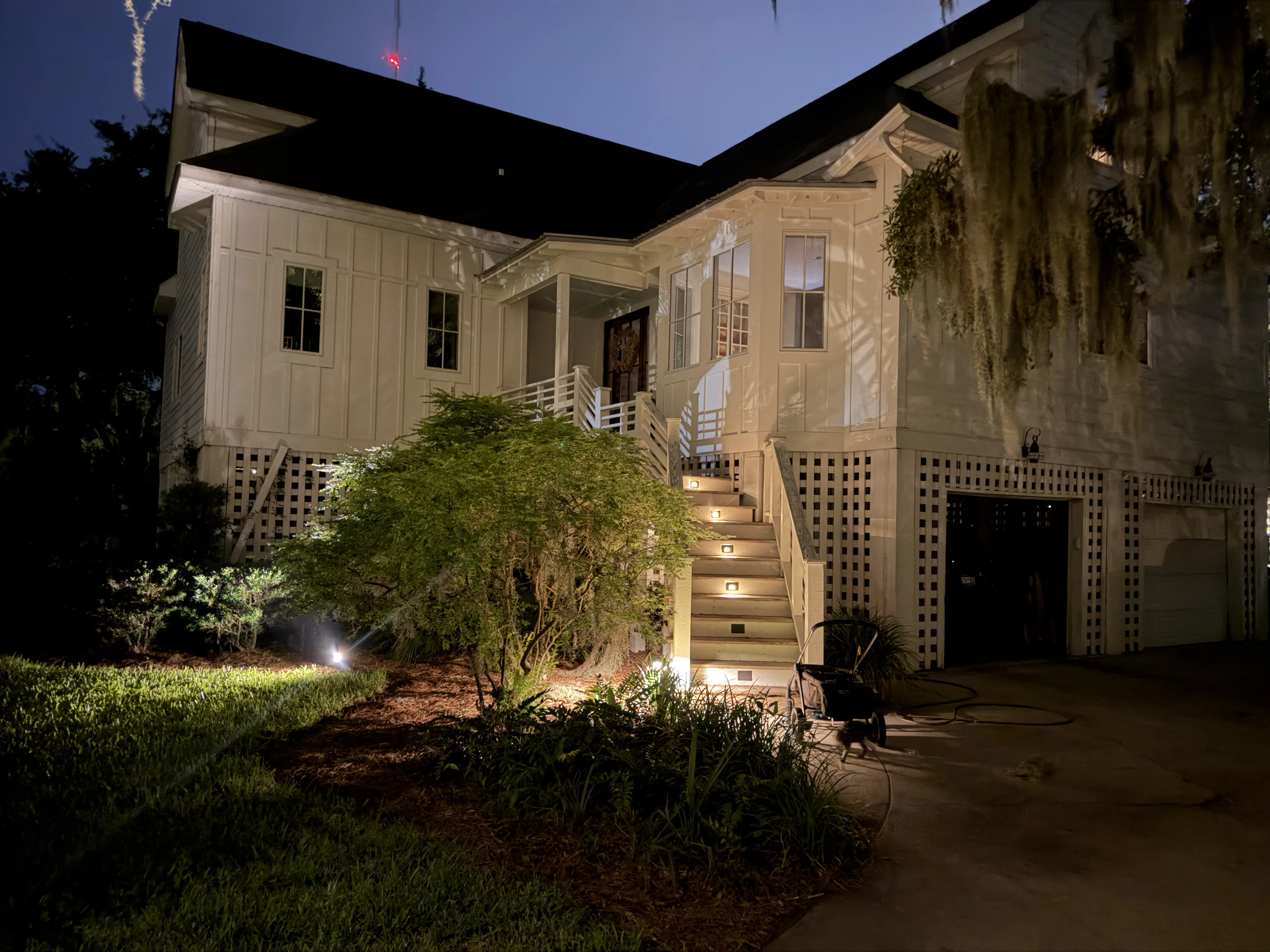 Warm low voltage stair lighting on outdoor steps at a Mount Pleasant SC home
